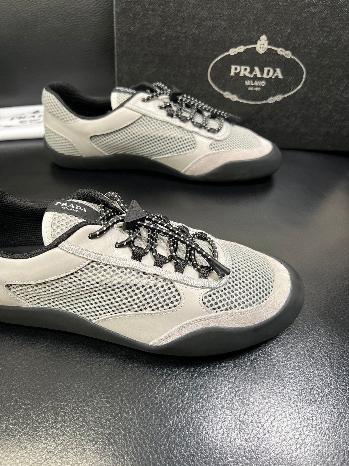 Prada White, Gray & Black Low-Top Sneakers